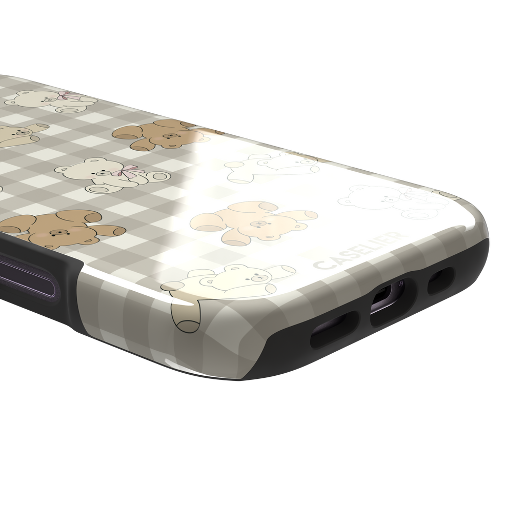 Teddybears phone case in a grey-toned gingham variant with beige and ivory illustrated teddy bears and pink bow details — tough case, charging port detail