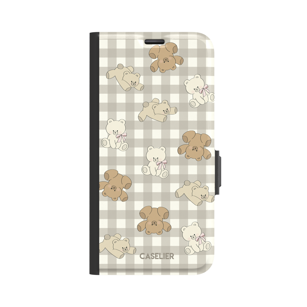 Teddybears phone case in a grey-toned gingham variant with beige and ivory illustrated teddy bears and pink bow details — wallet case, front view