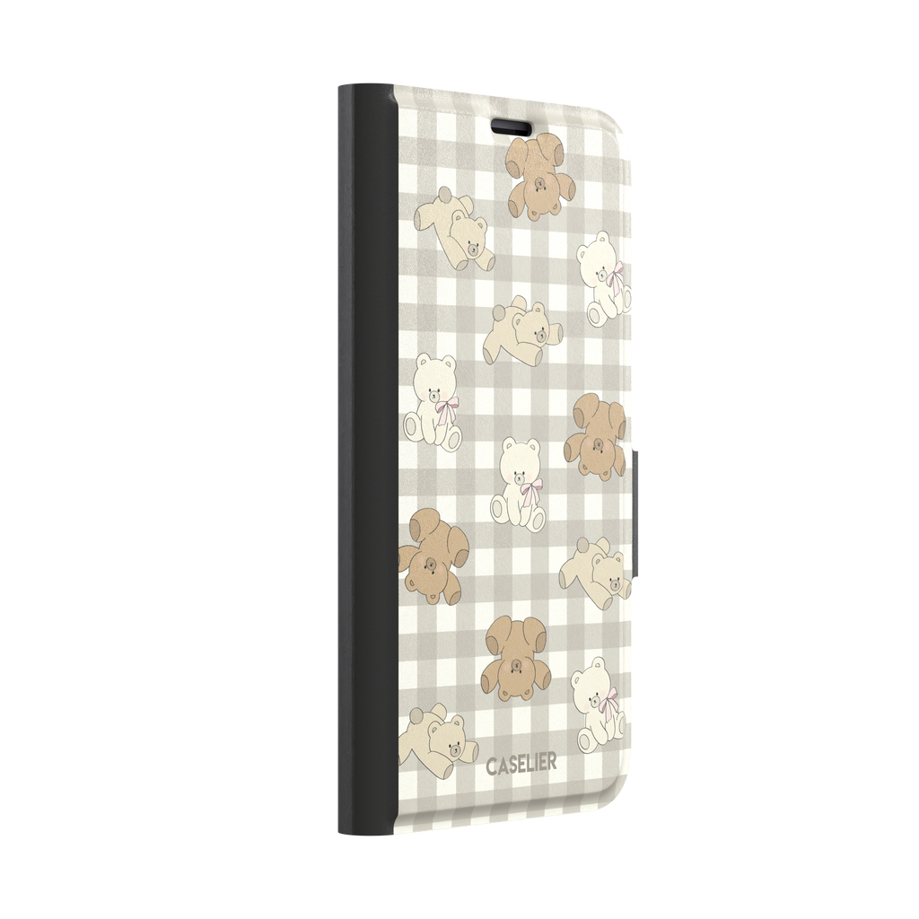 Teddybears phone case in a grey-toned gingham variant with beige and ivory illustrated teddy bears and pink bow details — wallet case, left view