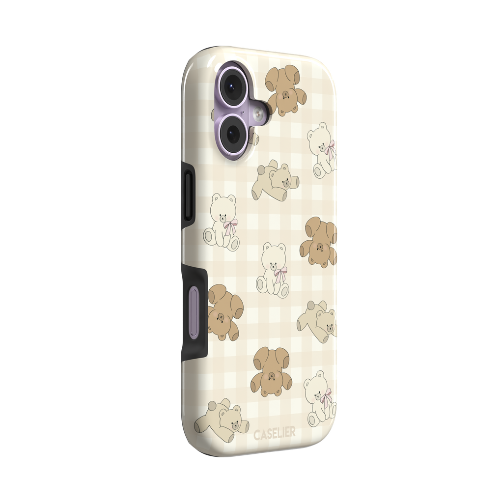 Teddybears phone case in warm cream with illustrated beige and ivory teddy bears scattered over a gingham grid pattern, some bears wearing soft pink bows — tough case, left view