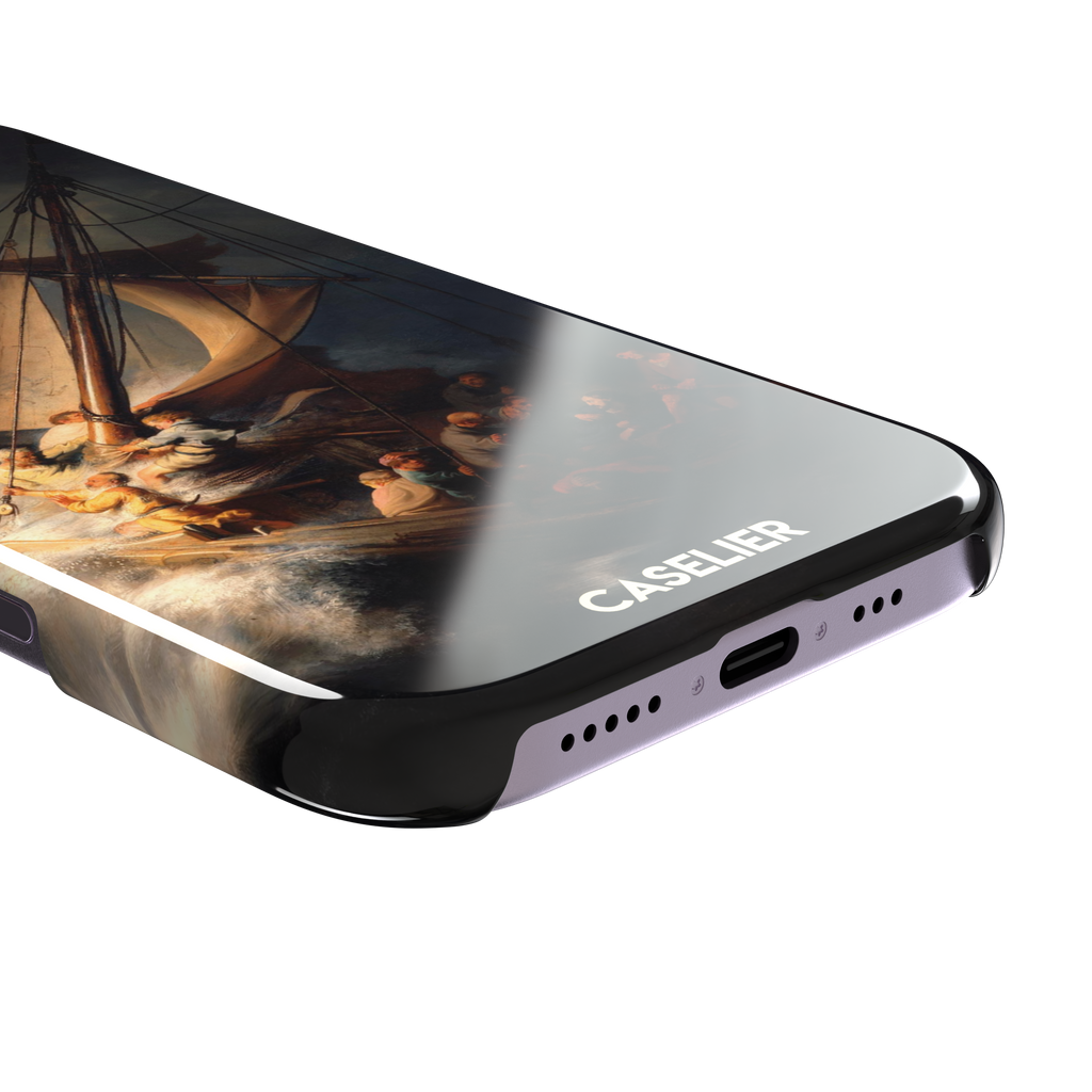 The Storm on the Sea of Galilee by Rembrandt, dark tempestuous ocean, golden-lit figures on a tilting sailboat with billowing sails and dramatic chiaroscuro — snap case, charging port detail