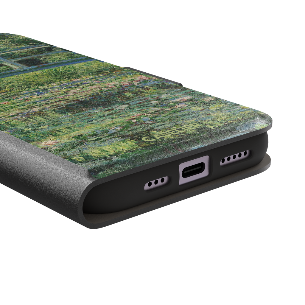 The Water Lily Pond by Claude Monet phone case showing the Japanese bridge over a green lily-covered pond with soft impressionist brushwork in deep greens and pink water lilies, phone case by Caselier — wallet case, charging port detail