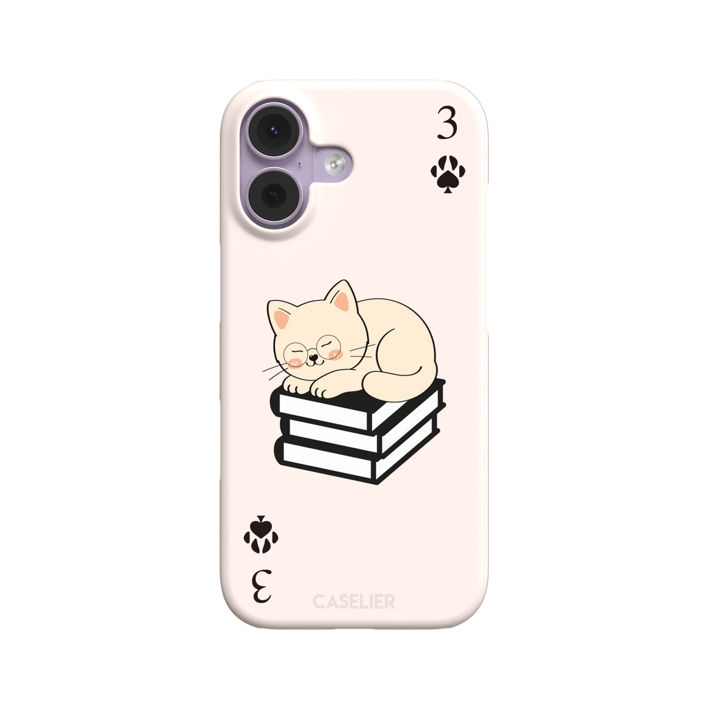 Three of Spades phone case in blush pink with a sleepy illustrated cat resting on stacked books and paw print spade symbols at each corner, by Caselier — snap case, front view