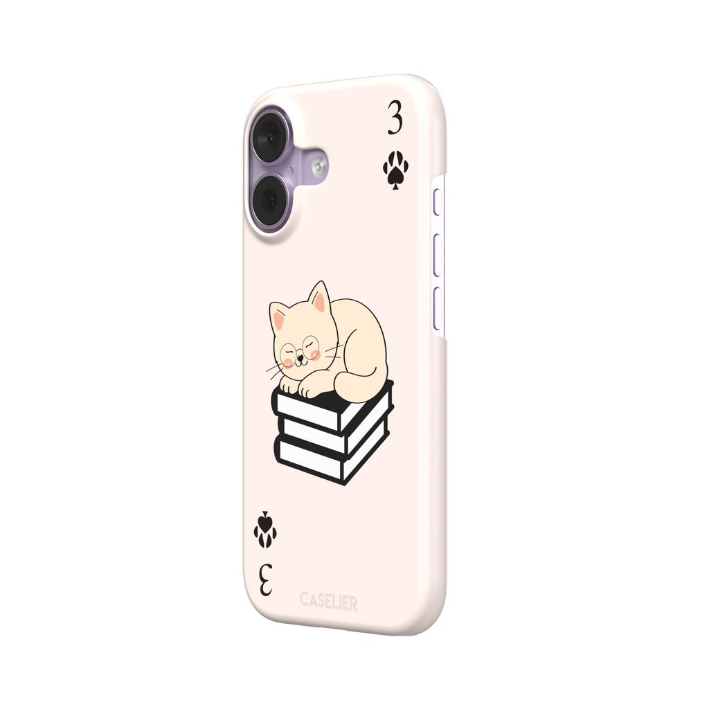 Three of Spades phone case in blush pink with a sleepy illustrated cat resting on stacked books and paw print spade symbols at each corner, by Caselier — snap case, right view
