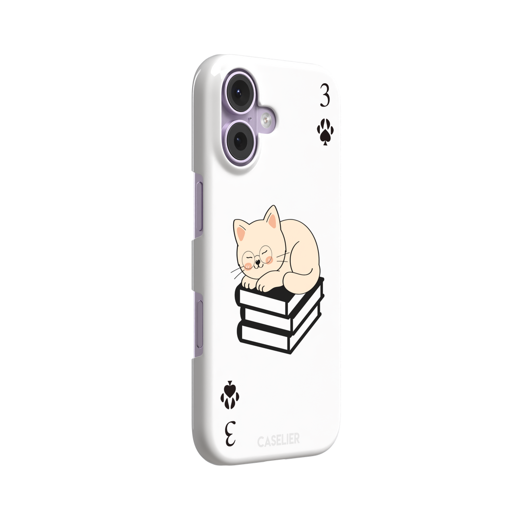 Three of Spades phone case in white with a sleepy illustrated cat resting on stacked books and paw print spade symbols at each corner, by Caselier — snap case, left view