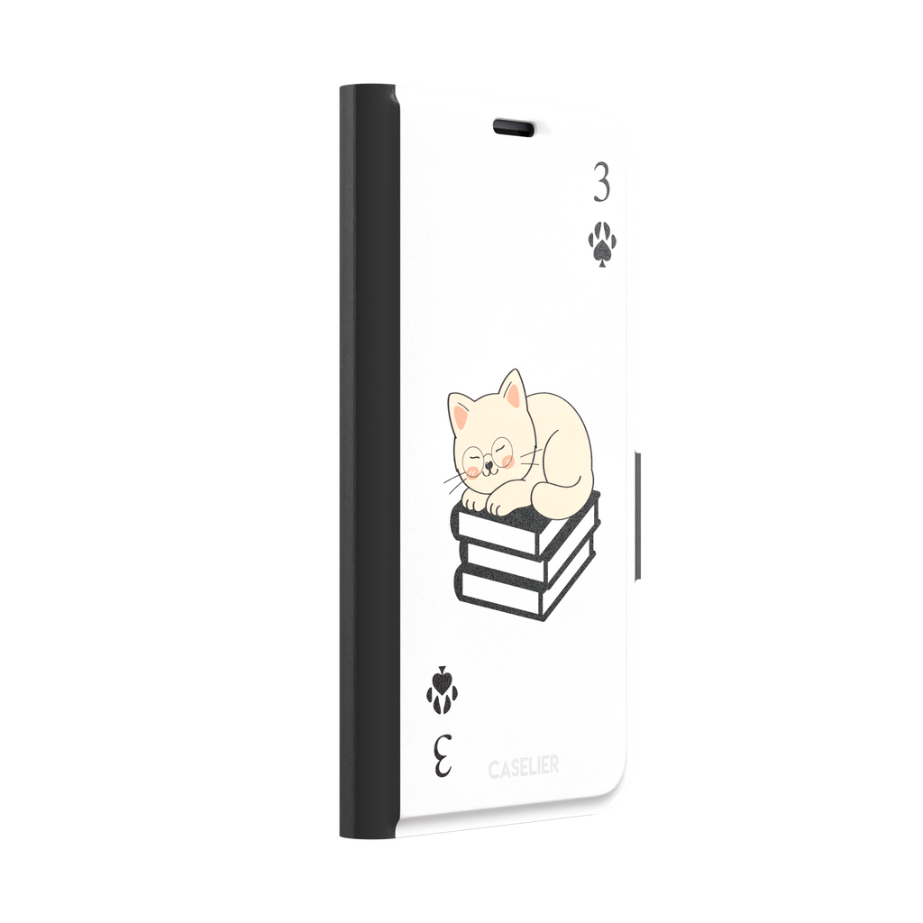 Three of Spades phone case in white with a sleepy illustrated cat resting on stacked books and paw print spade symbols at each corner, by Caselier — wallet case, left view