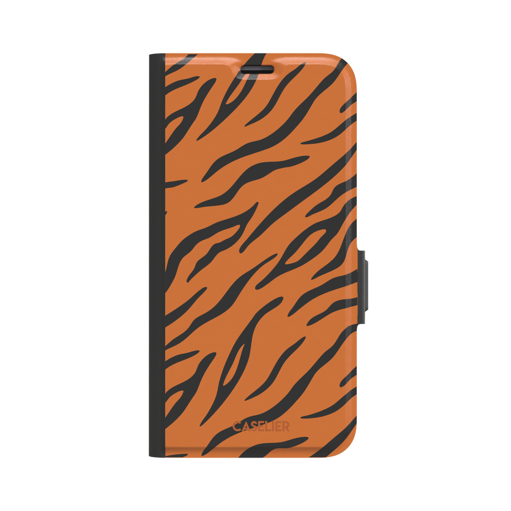 Tiger print phone case in orange with bold black stripes, full-bleed animal print design, phone case by Caselier — wallet case, front view