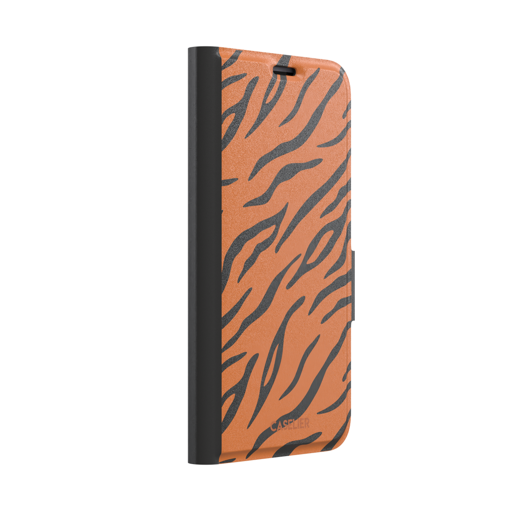 Tiger print phone case in orange with bold black stripes, full-bleed animal print design, phone case by Caselier — wallet case, left view