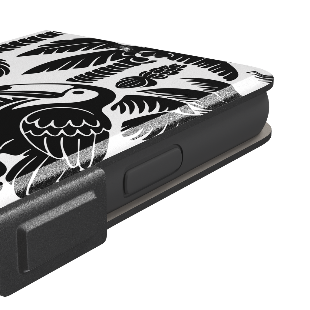 Tropical phone case in monochrome black and white showing the same jungle illustration of a leopard, toucan, crocodile, and tropical foliage — wallet case, volume buttons detail