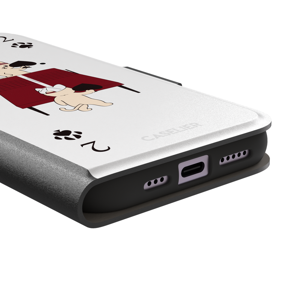 Two of Spades phone case in white from the Paw Decks collection, showing two cartoon cats playing ping pong with spade paddles across a red table, with paw print card markings, phone case by Caselier — wallet case, charging port detail