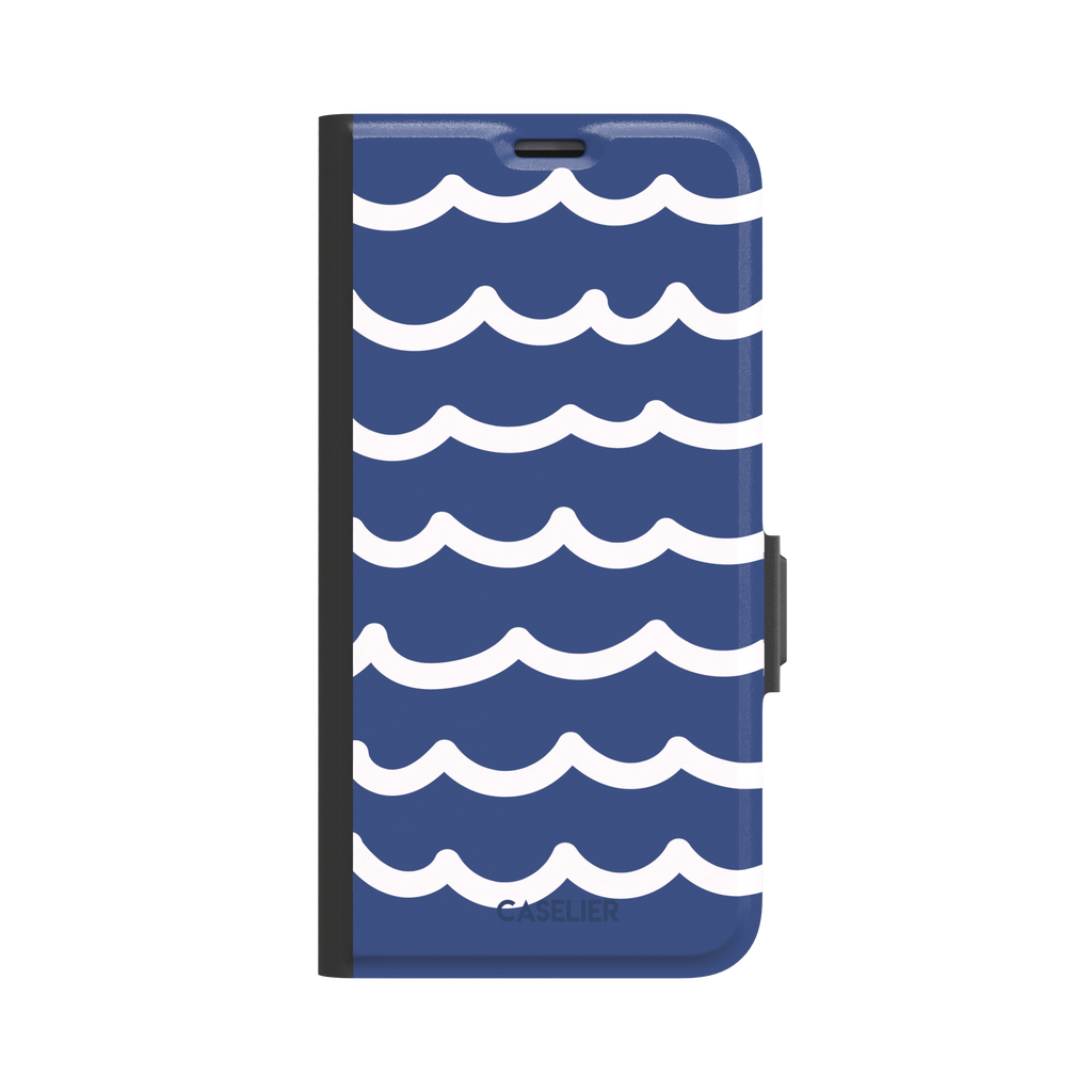 Waves phone case in deep navy blue with stacked white graphic wave stripes, Memories of Summer collection, phone case by Caselier — wallet case, front view
