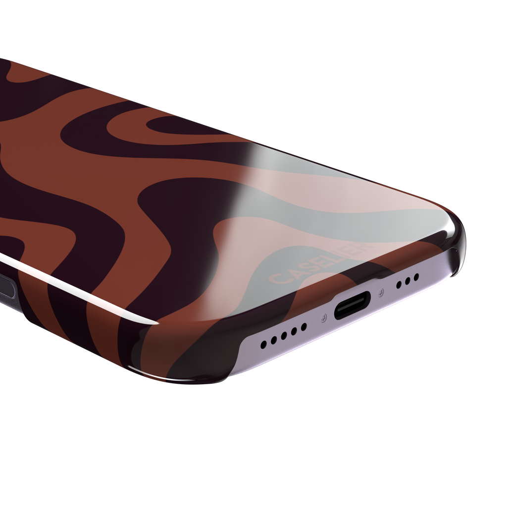 Wavey abstract phone case in terracotta and dark burgundy fluid swirl pattern, phone case by Caselier — snap case, charging port detail