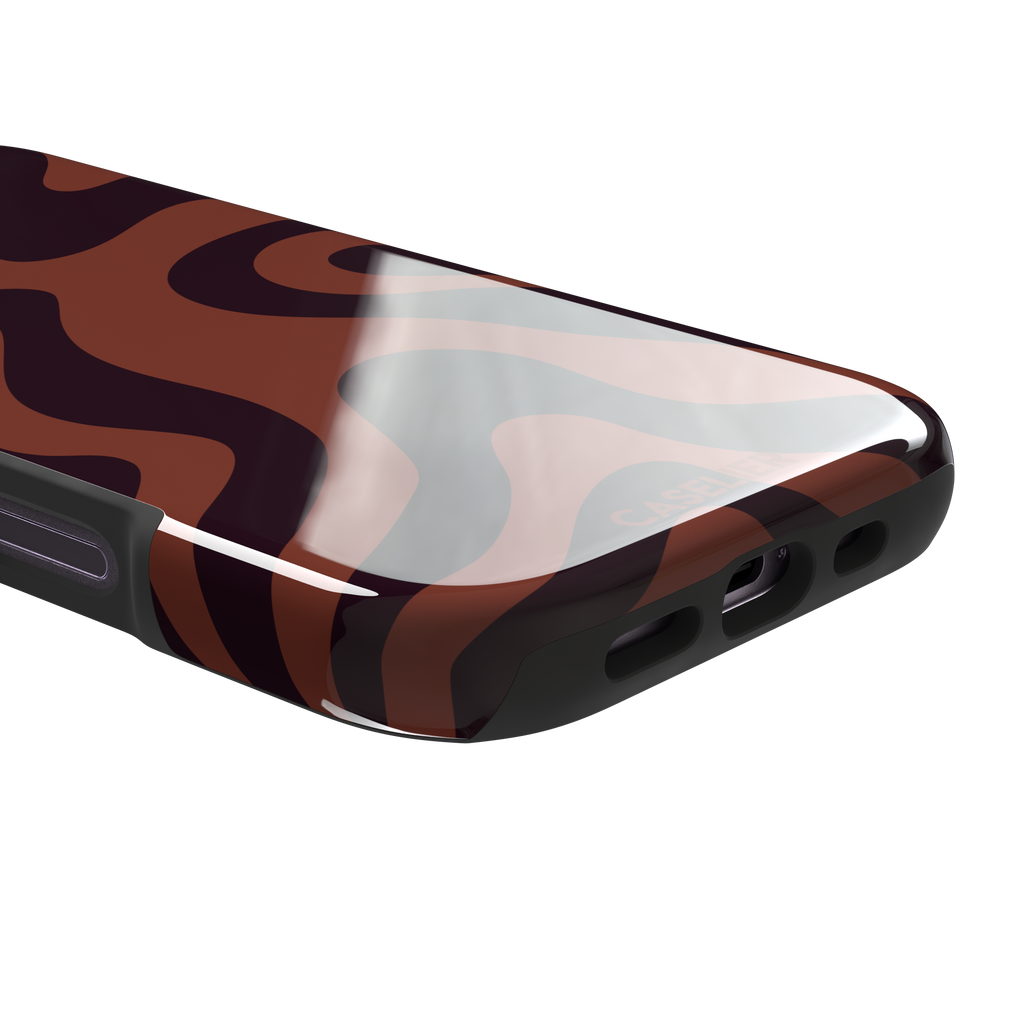 Wavey abstract phone case in terracotta and dark burgundy fluid swirl pattern, phone case by Caselier — tough case, charging port detail