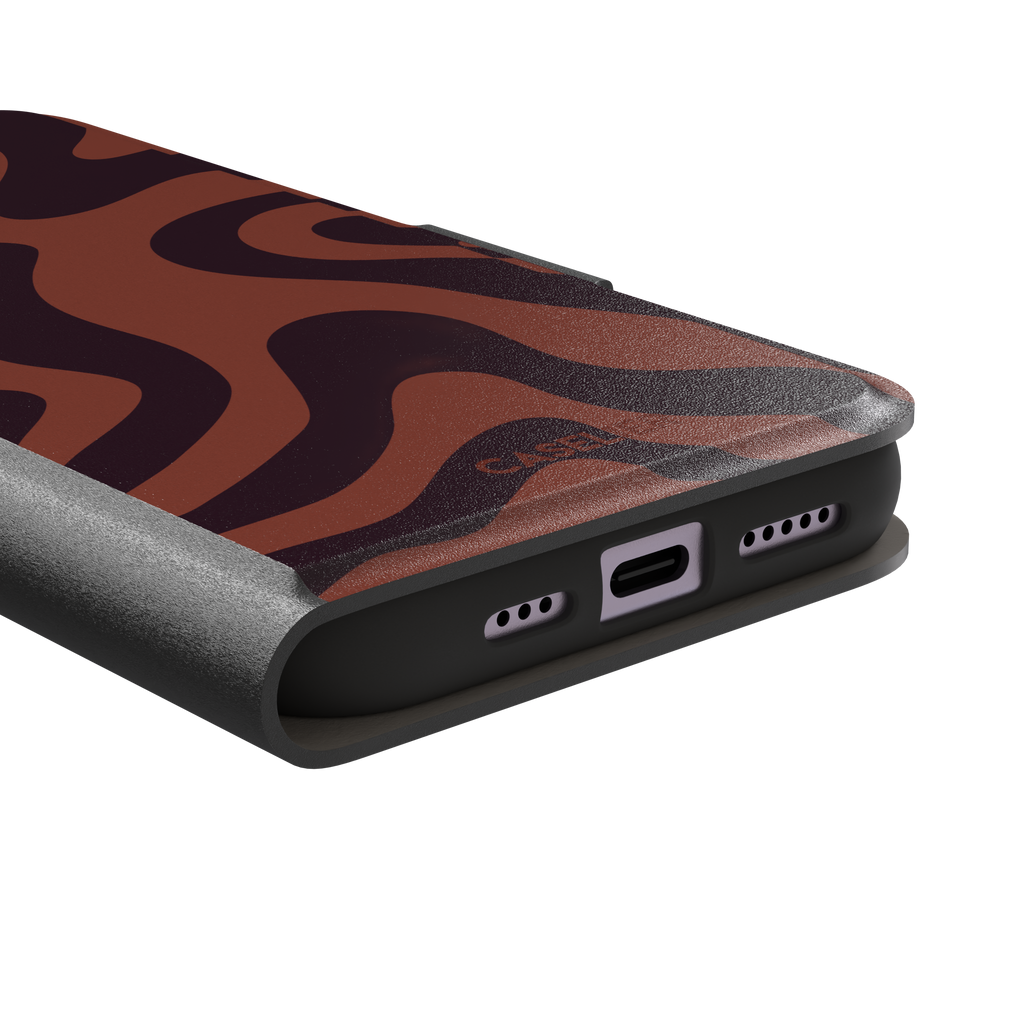 Wavey abstract phone case in terracotta and dark burgundy fluid swirl pattern, phone case by Caselier — wallet case, charging port detail