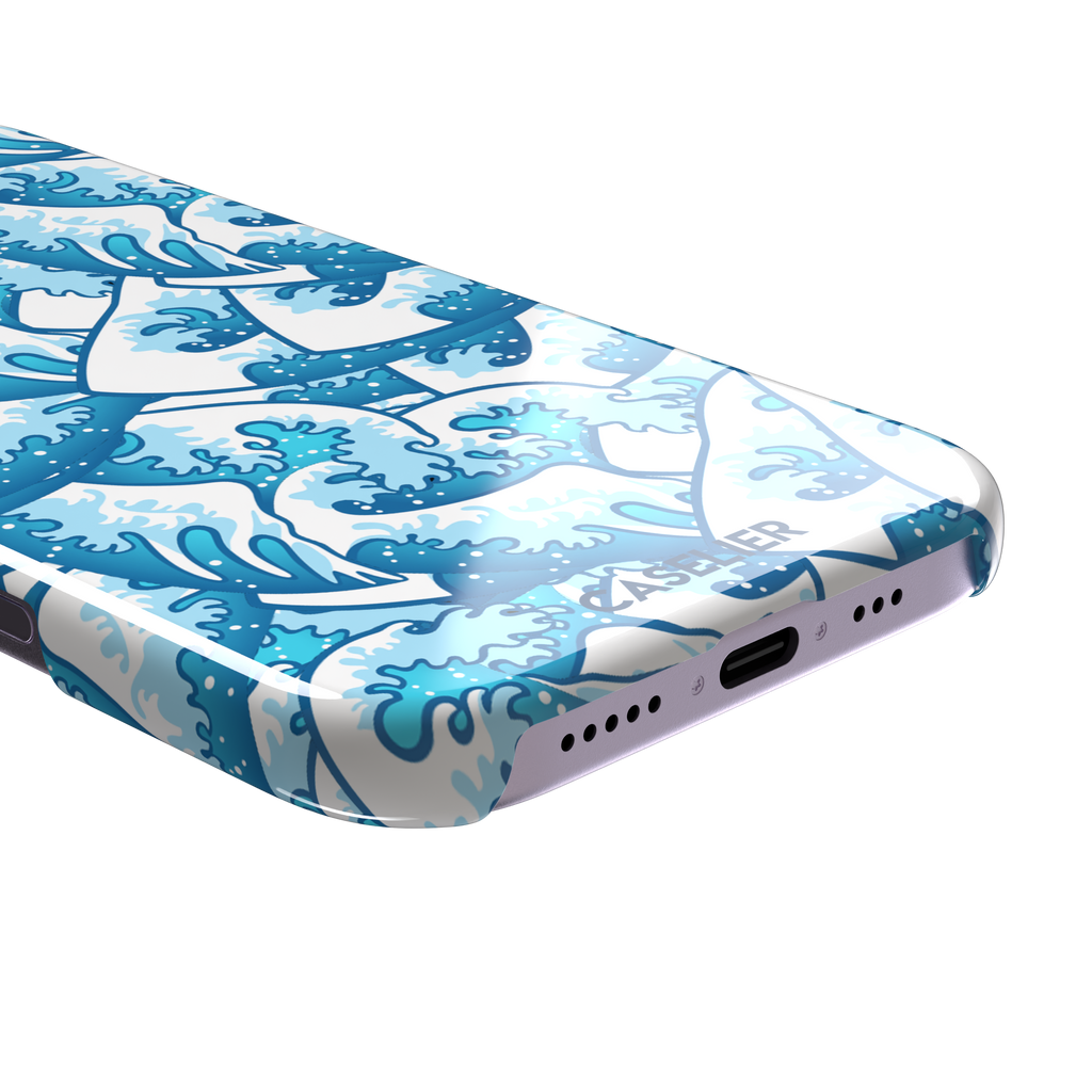 Wet Waves phone case with an all-over Japanese-style wave pattern in cobalt and sky blue on white, by Caselier — snap case, charging port detail