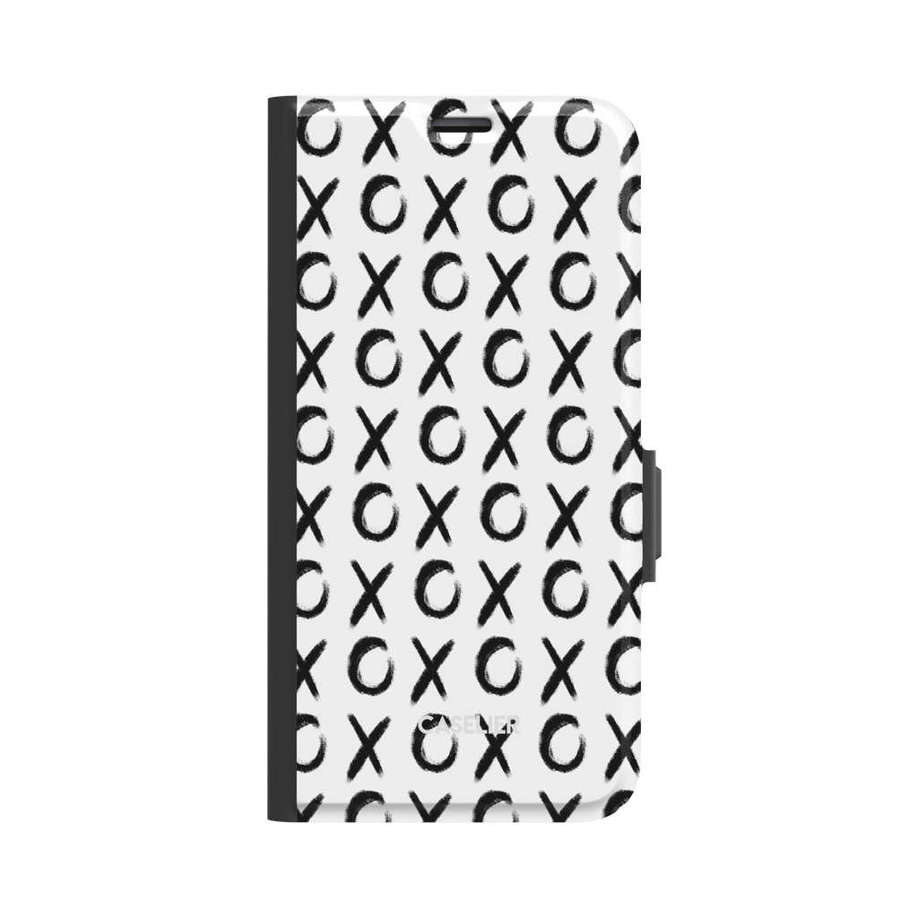 XOXO folio wallet phone case with hand-brushed black X and O repeat pattern on a white background, black spine and clasp visible, front cover view, phone case by Caselier